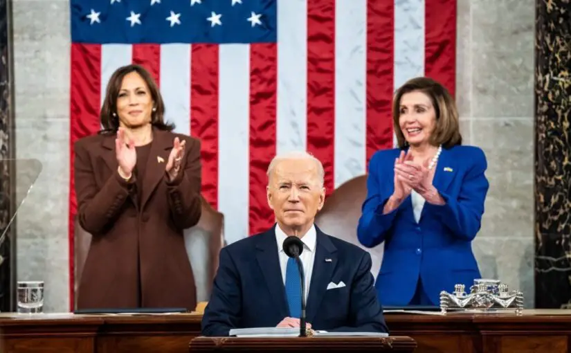 President Biden speaks during his first State of the Union speech. Vice President Kamala Harris (left), and Speaker of the House Nancy Pelosi (right) stand behind him.