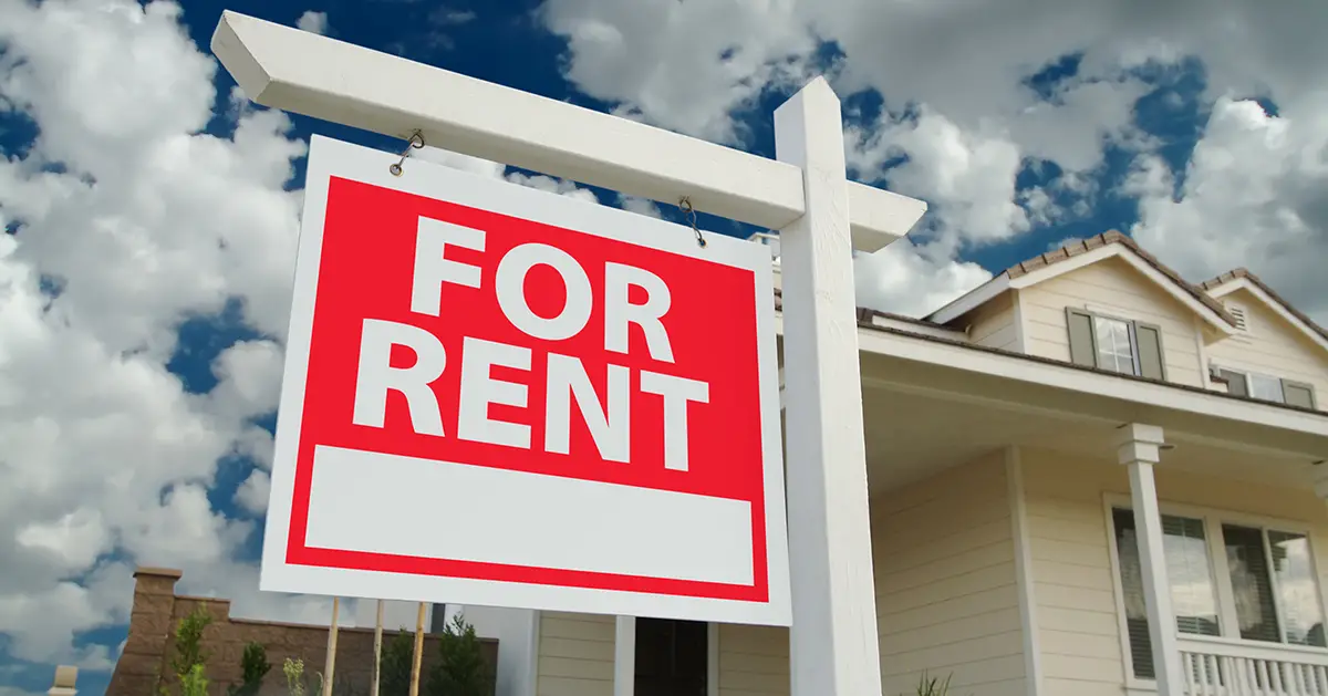 Photo of single family home with "For Rent" sign posted. Photo by Adobe Stock