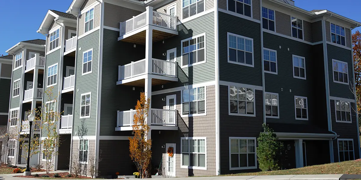 Photo of a modern apartment community with porches.