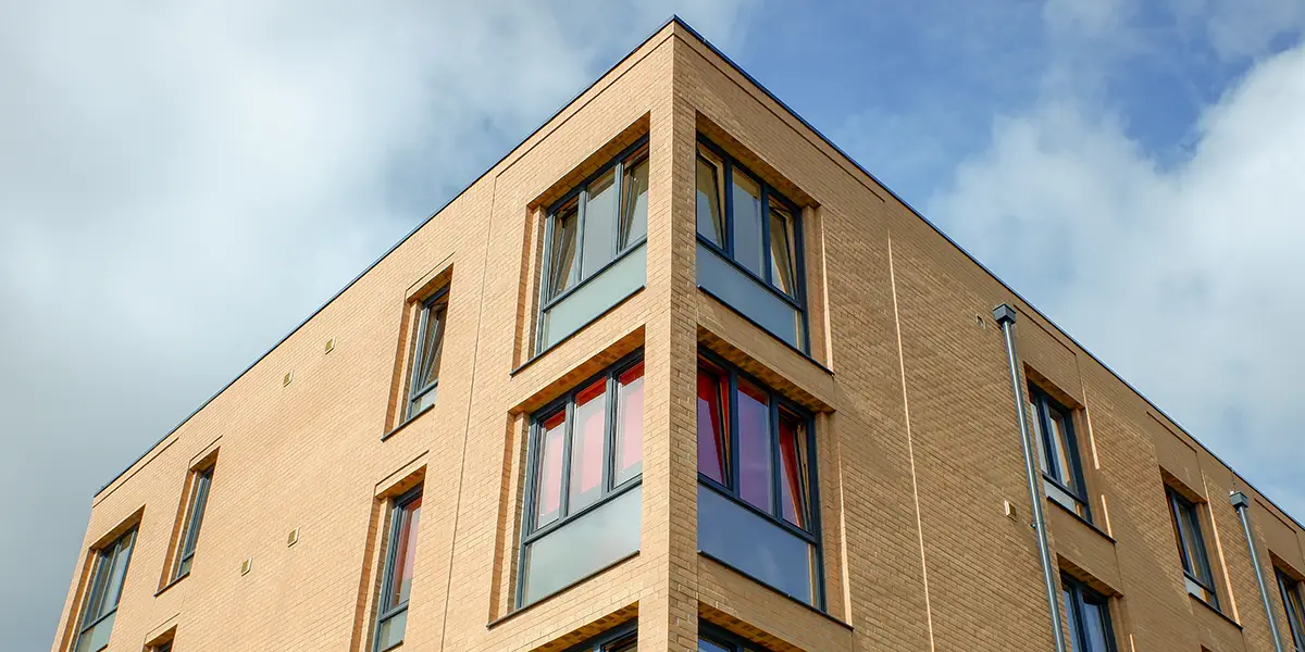 Photo of an apartment exterior for Affordable Housing Online's Project-Based Voucher guide.